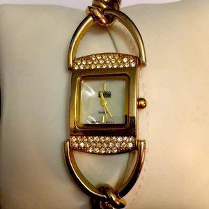 Gold and rhinestone Quartz chain link bracelet watch.